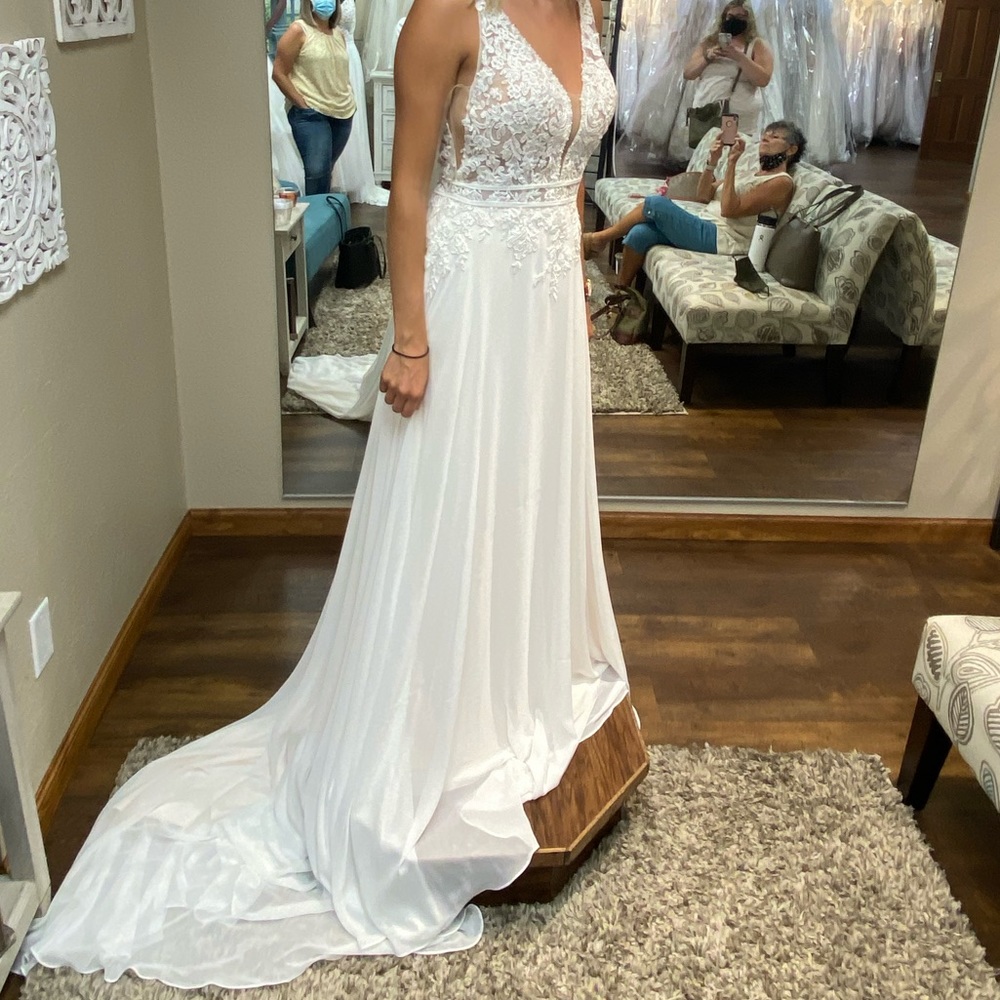 Never worn wedding dress. Size 8. Unaltered. Ivory Prosecco.